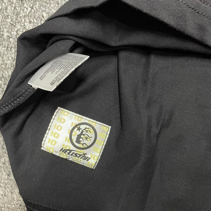 Hellstar Adventure Astronaut T-Shirt wash label with size fabric and care information
Bottom hem stitching detail on the black Hellstar Adventure graphic T-shirt