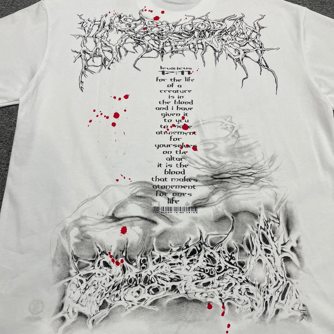 Full red and pink layered face graphic on Hellstar Red Face white T-shirt
Close-up of red face artwork and rhinestone embellishments on Hellstar white T-shirt
Close-up of crystal rhinestone details on Hellstar Red Face graphic T-shirt
Red paint splatter print detail on Hellstar Red Face white graphic T-shirt
Green Om symbol detail on Hellstar Red Face rhinestone graphic T-shirt