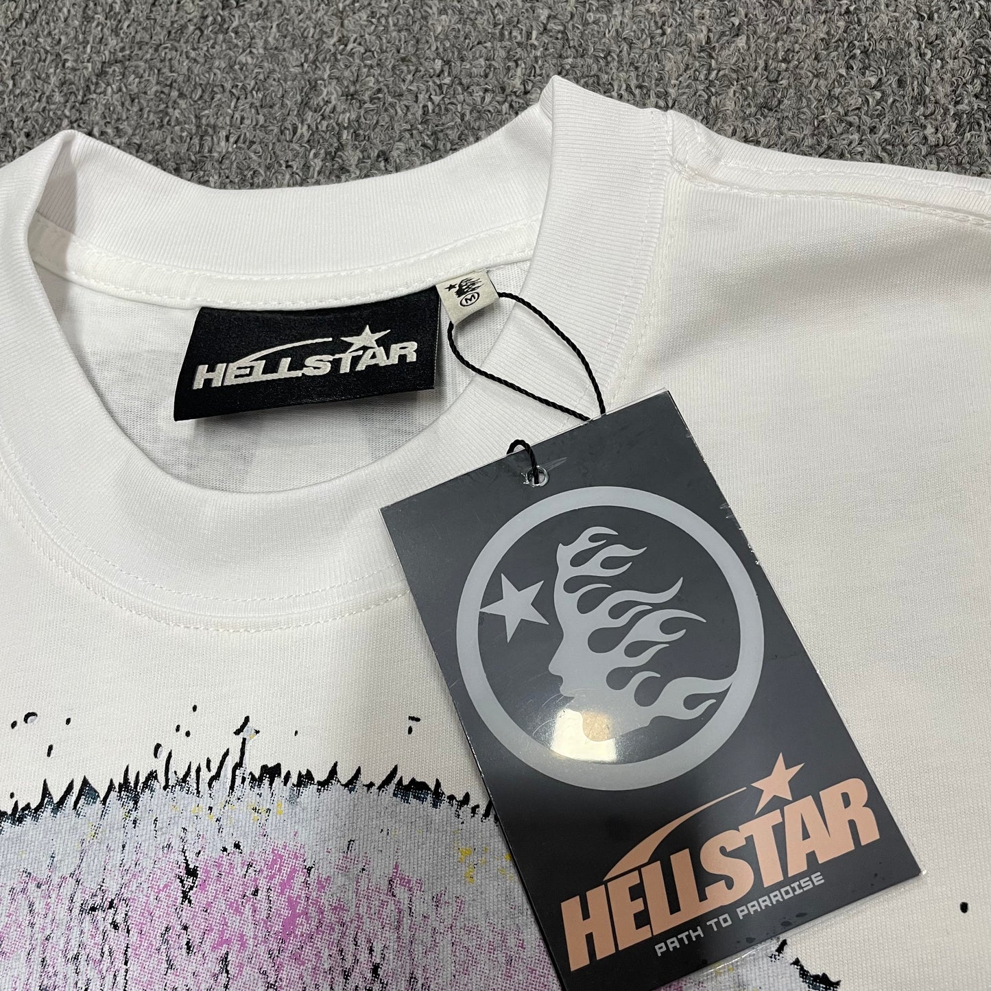 Crew neck collar and stitching detail on Hellstar Goggles graphic T-shirt
Hellstar size label detail inside Goggles graphic T-shirt
Hellstar branded hangtag attached to Goggles graphic T-shirt
Hellstar size label detail inside Goggles graphic T-shirt