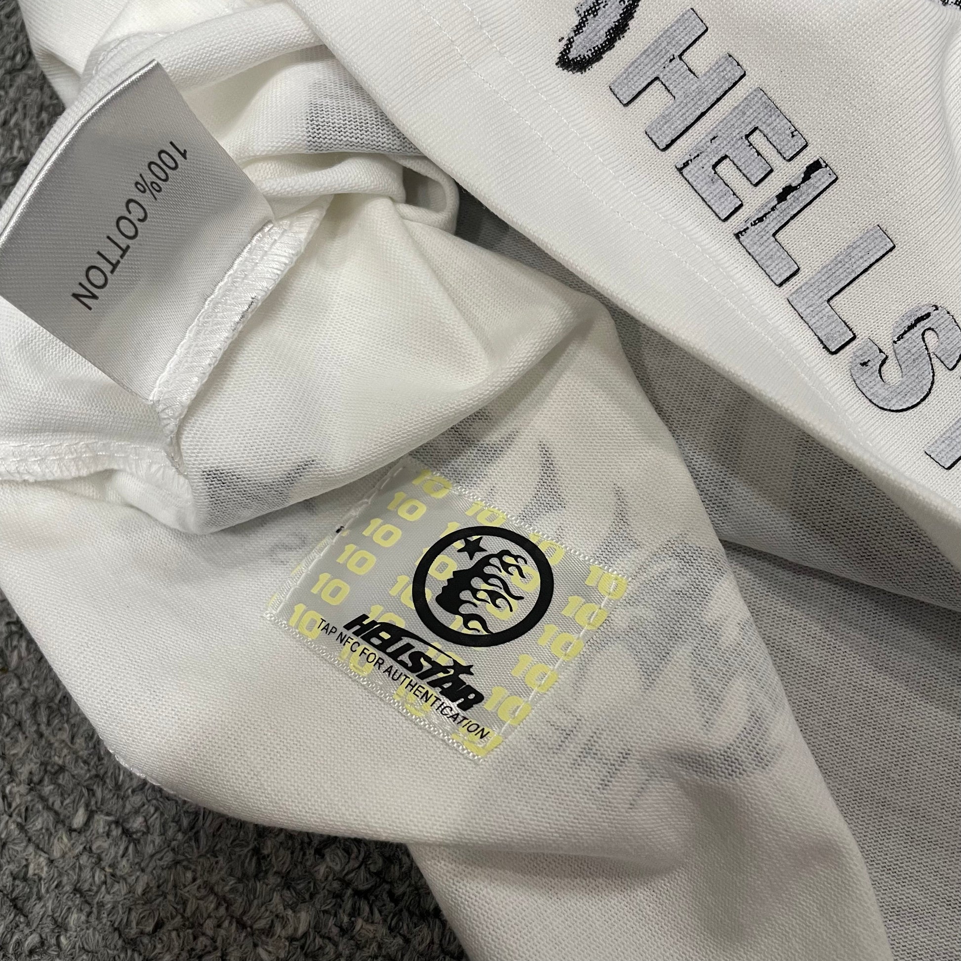 Hellstar wash care label inside Goggles graphic T-shirt
NFC tag detail attached to Hellstar Goggles graphic T-shirt