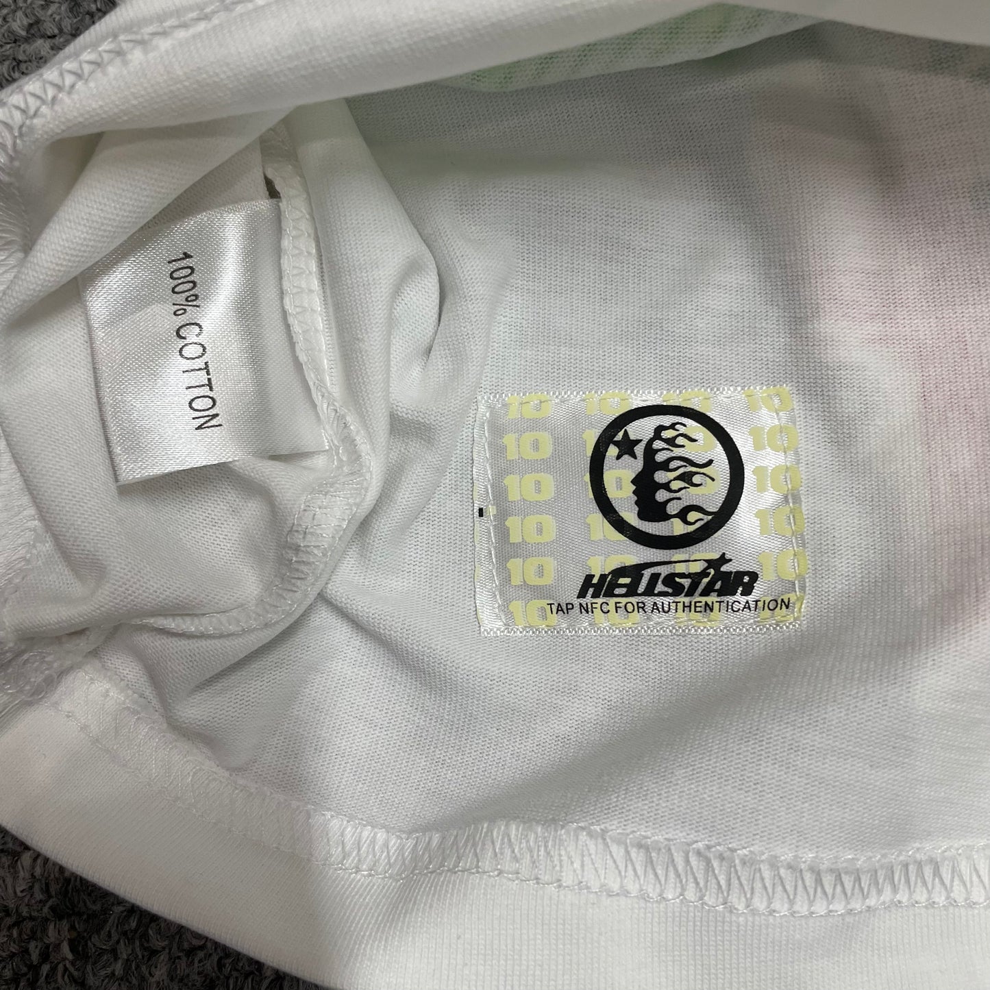 Hellstar wash care label inside Jesus King of Kings graphic T-shirt
NFC tag detail attached to Hellstar Jesus white graphic T-shirt