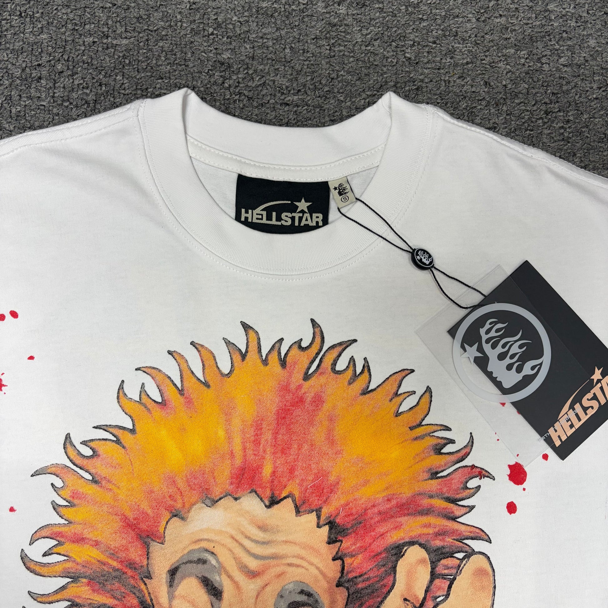 Crew neck collar and stitching detail on Hellstar Evil Eye white T-shirt
Hellstar woven neck label inside Evil Eye white graphic T-shirt
Hellstar woven neck label inside Evil Eye white graphic T-shirt
Hellstar size label detail inside Evil Eye white T-shirt
Hellstar branded hangtag attached to Evil Eye white graphic T-shirt
