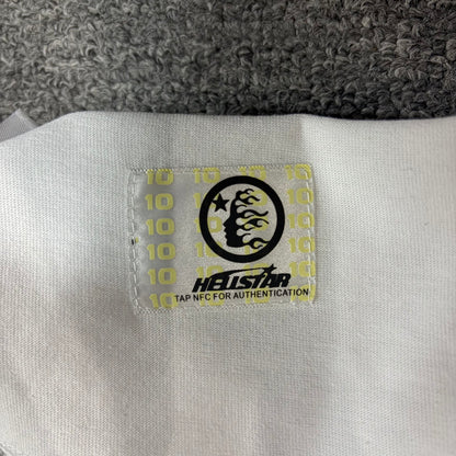 NFC tag detail attached to Hellstar Evil Eye white T-shirt