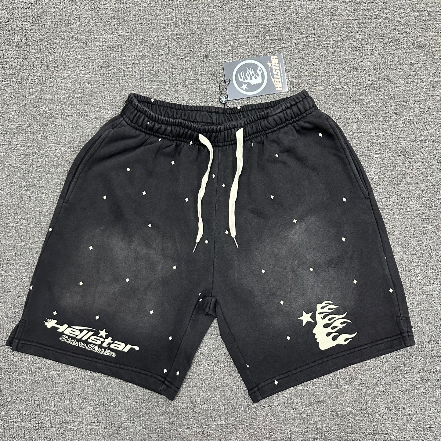 Hellstar Path to Paradise washed black graphic shorts front view
Close-up of elasticated waistband construction on Hellstar black shorts
Detailed view of gathered elastic waist on Hellstar Path to Paradise shorts