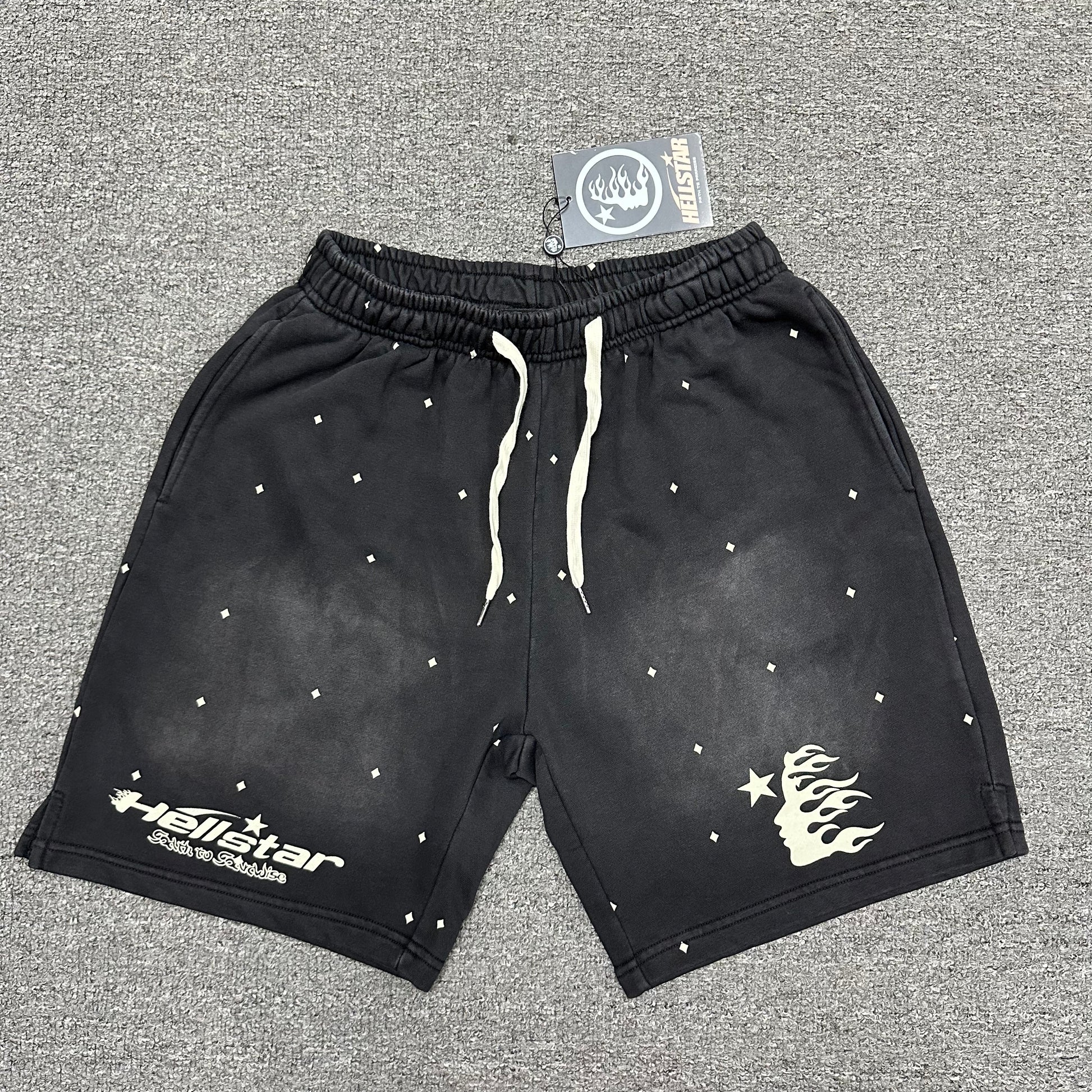 Hellstar Path to Paradise washed black graphic shorts front view
Close-up of elasticated waistband construction on Hellstar black shorts
Detailed view of gathered elastic waist on Hellstar Path to Paradise shorts
