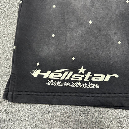Full front graphic layout on Hellstar Path to Paradise washed black shorts
Close-up of Hellstar wordmark printed on the left leg of black shorts
