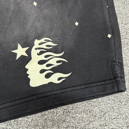 Close-up of Path to Paradise text beneath the Hellstar leg logo
Signature Hellstar flame-face logo printed on the right leg of black shorts
All-over white mini diamond pattern on Hellstar washed black shorts
Close-up of small white diamond graphics on Hellstar black shorts