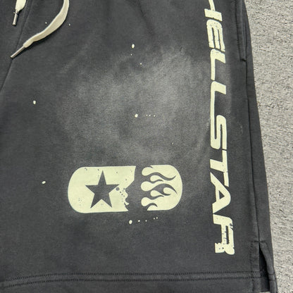 Vertical cream Hellstar logo printed on the left leg of black shorts
Vertical cream Hellstar logo printed on the right leg of black shorts
Signature Hellstar flame-face logo printed on the right leg of black shorts
Close-up of cream star detail beside the Hellstar flame-face logo