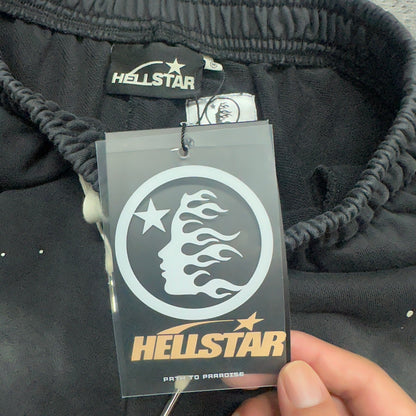 Close-up of elasticated waistband construction on Hellstar black shorts
Detailed view of gathered elastic waist on Hellstar graphic shorts
Hellstar branded waistband label inside washed black shorts
Size label inside Hellstar Vertical Logo graphic shorts
Hellstar branded hang tag attached to washed black graphic shorts
NFC tag detail on Hellstar Vertical Logo washed black shorts