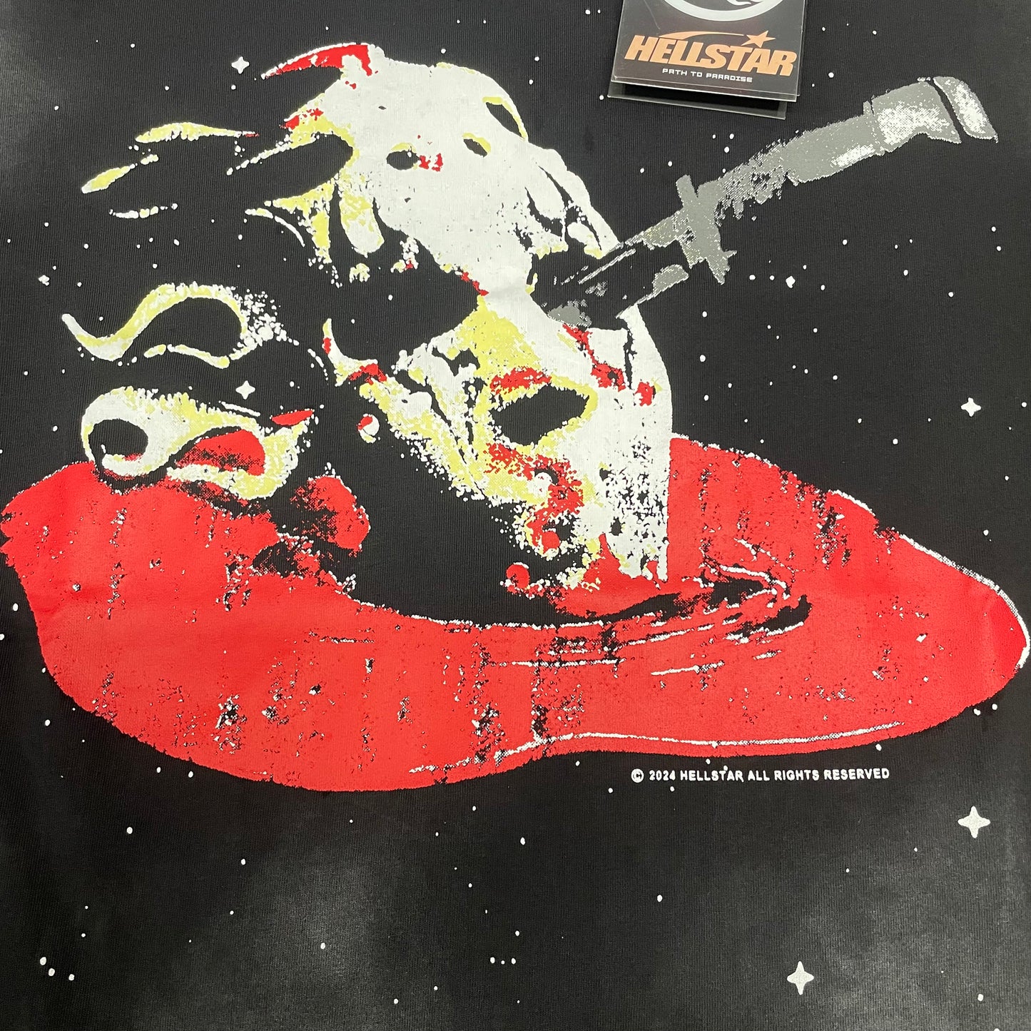 Full alien skeleton and red flying saucer graphic on Hellstar washed black T-shirt
Detailed white red yellow and grey alien artwork on Hellstar graphic T-shirt
Alien-like skeletal character graphic detail on Hellstar Attacks Planet T-shirt
Distressed skeletal figure artwork on Hellstar UFO graphic T-shirt