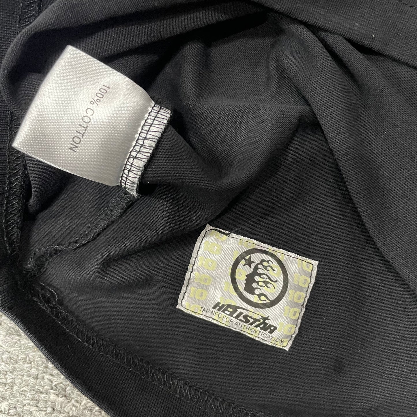 Hellstar wash care label inside I See Humans But No Humanity T-shirt
NFC tag detail attached to Hellstar I See Humans But No Humanity T-shirt