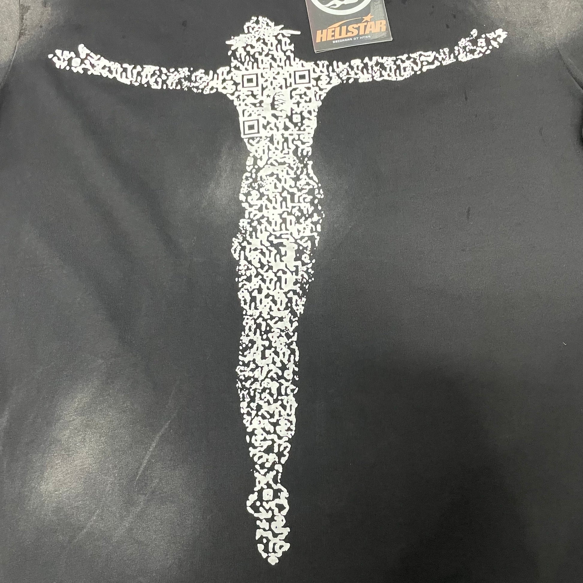 Full white QR-code Christ silhouette on Hellstar washed black T-shirt
Close-up of the QR Christ front graphic on Hellstar black T-shirt
Detailed white code-pattern print on Hellstar QR Christ T-shirt
Outstretched Christ figure graphic on Hellstar QR Code black T-shirt
QR-code square details within the Hellstar Christ silhouette graphic
