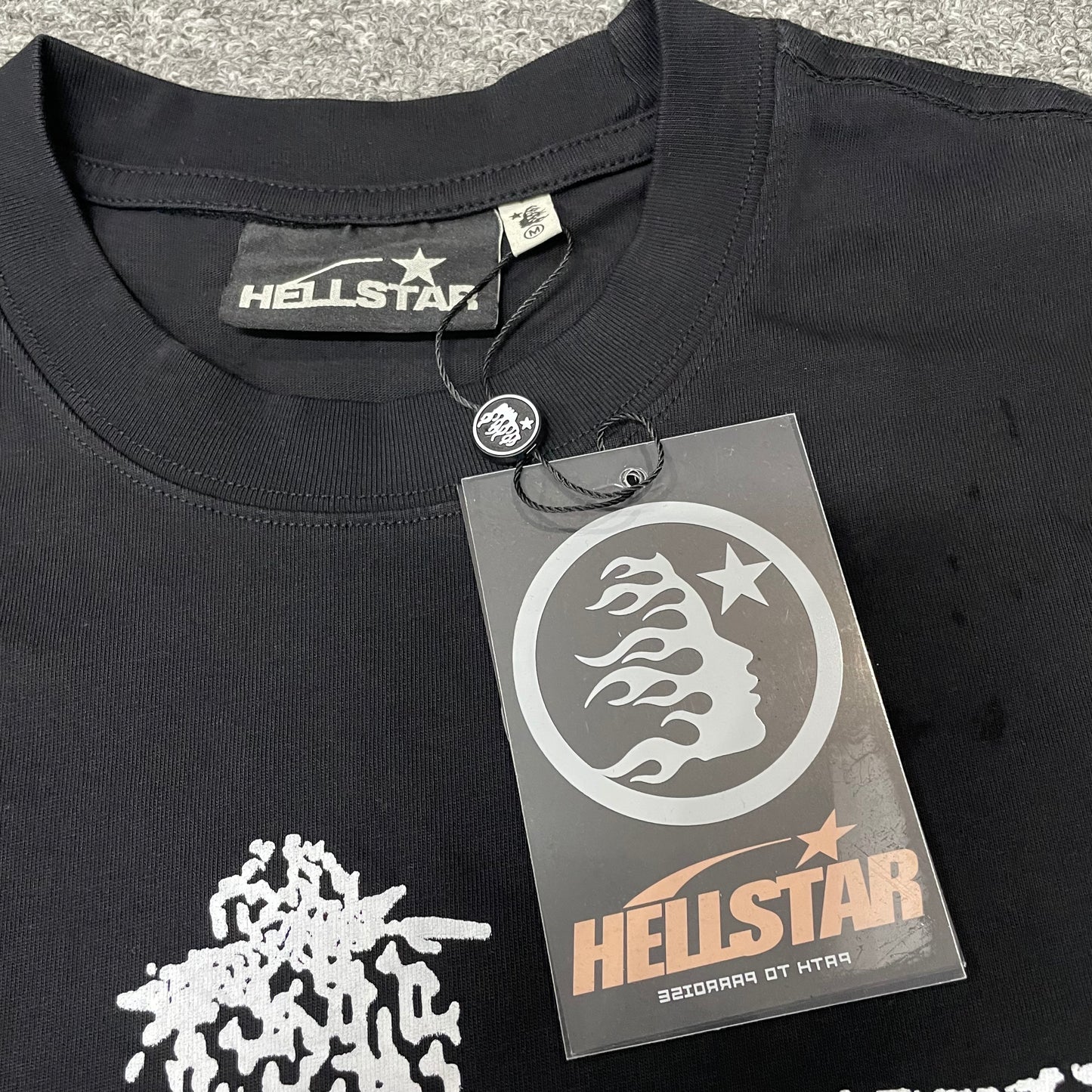 Crew neck collar and stitching detail on Hellstar QR Christ T-shirt
Hellstar woven neck label inside QR Christ washed black T-shirt
Hellstar size label detail inside QR Christ washed black T-shirt
Hellstar branded hangtag attached to QR Christ black T-shirt