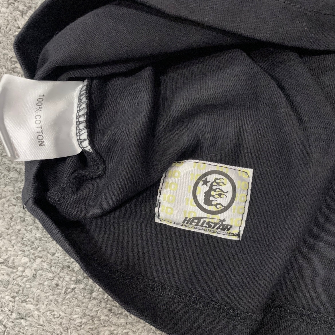 Hellstar wash care label inside QR Christ graphic T-shirt
NFC tag detail attached to Hellstar QR Christ washed black T-shirt