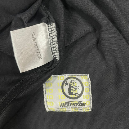 Hellstar wash care label inside Death to Paradise graphic T-shirt
NFC tag detail attached to Hellstar Death to Paradise T-shirt