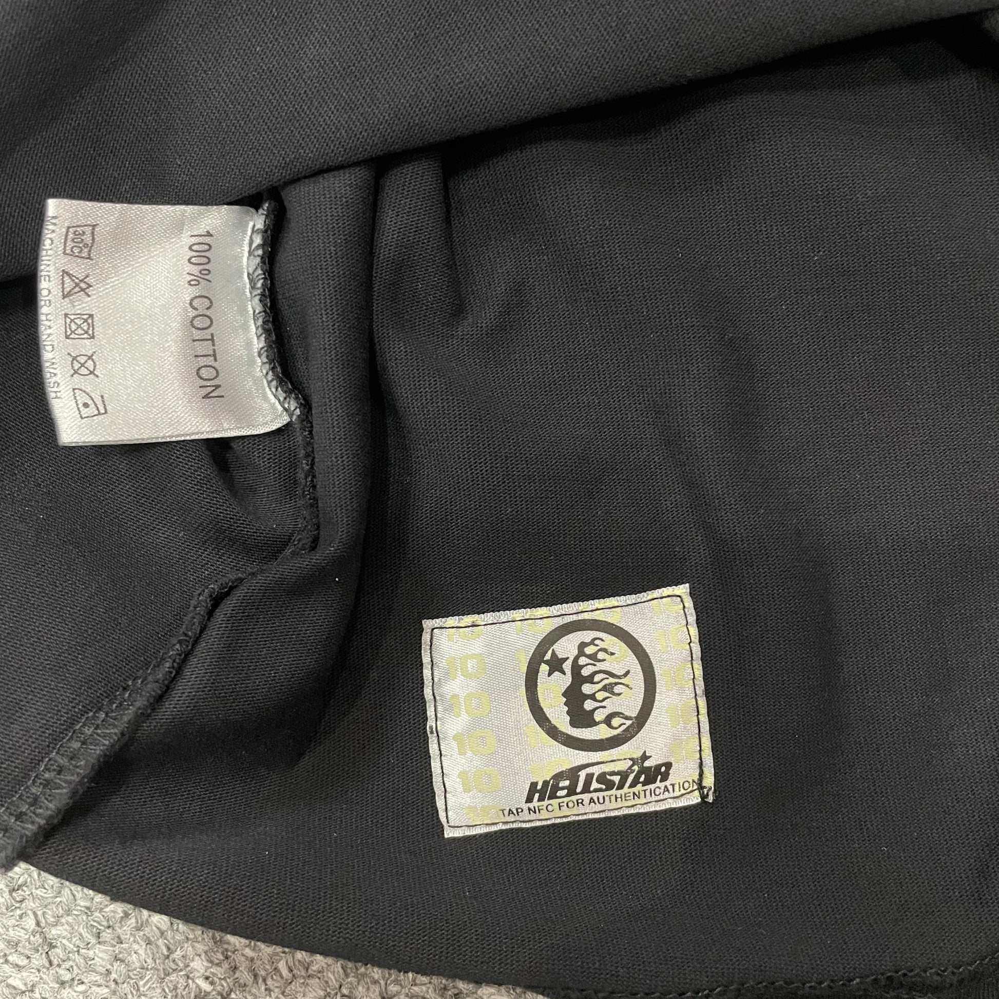 Hellstar wash care label inside I Love NY graphic T-shirt
NFC tag detail attached to Hellstar I Love NY washed black T-shirt