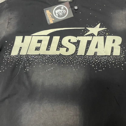 Full oversized Hellstar star logo graphic with rhinestones on washed black T-shirt
Close-up of Hellstar star logo print and reflective rhinestone embellishments
Reflective rhinestone details surrounding the Hellstar front logo
Close-up of distressed cut details on Hellstar washed black T-shirt