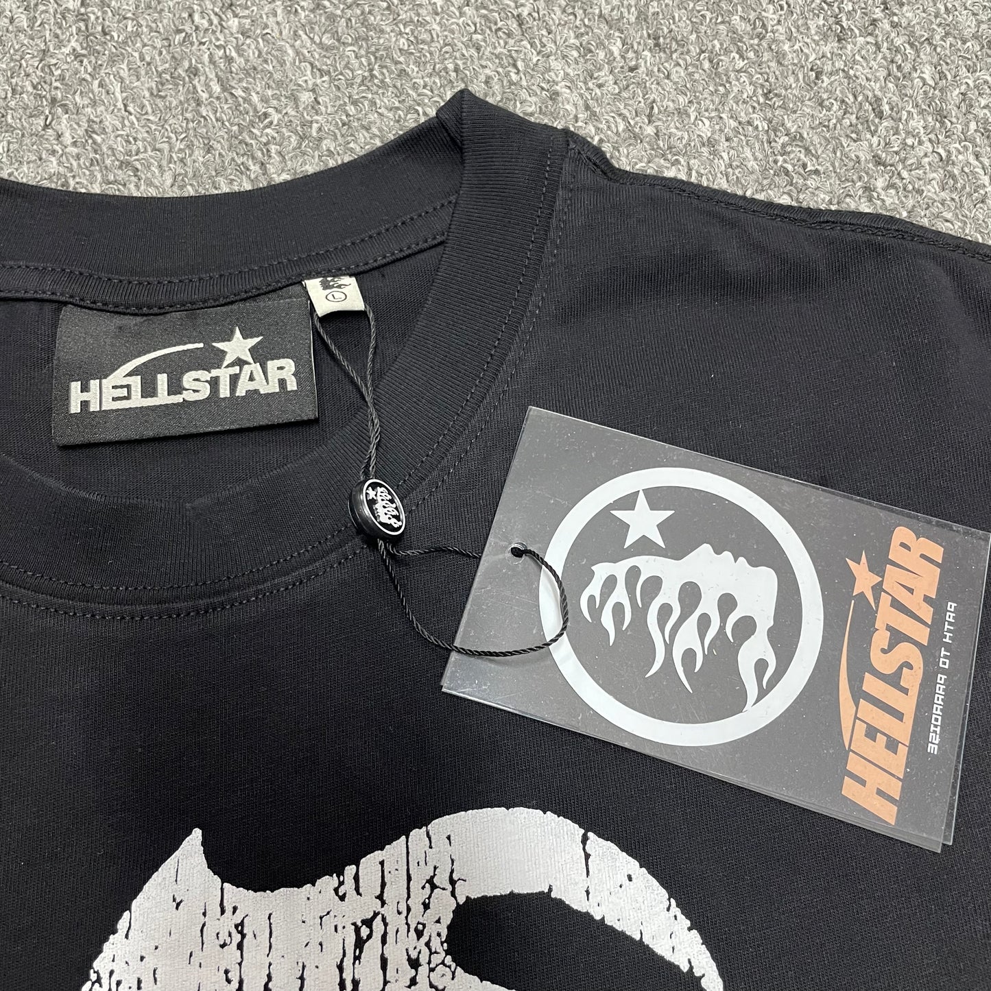 Hellstar neck label inside Flame Face washed black T-shirt
Hellstar branded hang tag attached to Flame Face black T-shirt