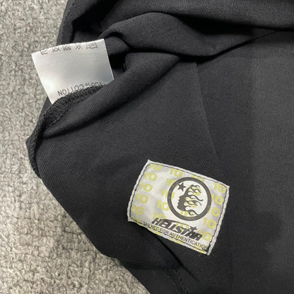 Fabric composition and care label inside Hellstar Flame Face T-shirt
NFC tag detail on Hellstar Flame Face washed black T-shirt