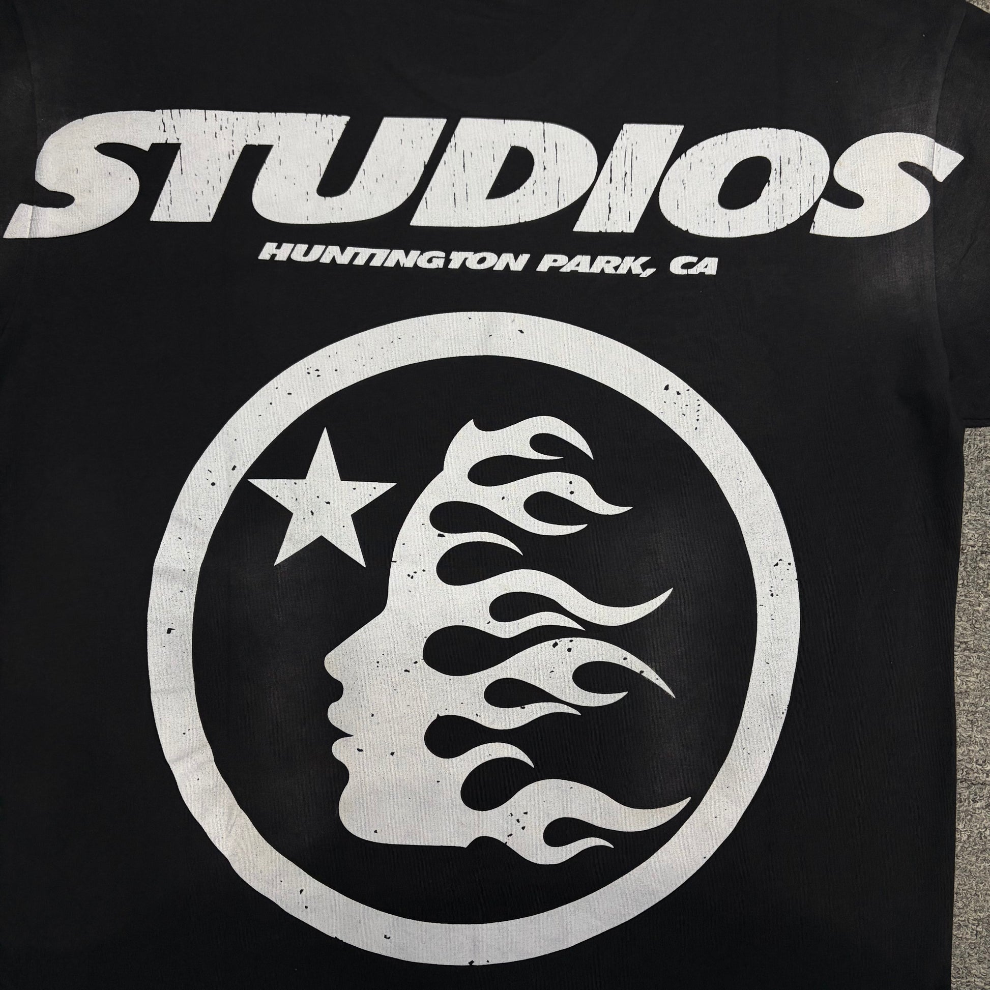 Oversized Studios Huntington Park flame-face graphic on black T-shirt