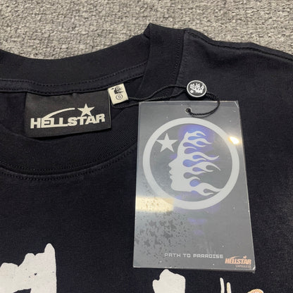 Close-up of ribbed crew neck and reinforced neckline stitching on Hellstar Glory T-shirt
Hellstar branded neck label inside Glory Doll graphic T-shirt
Size label inside Hellstar Glory Doll washed black T-shirt
Hellstar branded hang tag attached to Glory Doll graphic T-shirt