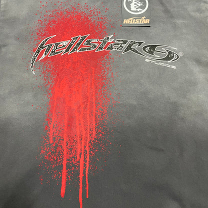 Full front Hellstar Studios logo with red spray-paint graphic on washed grey T-shirt
Hellstar Studios graphic with distressed lettering and red spray-paint drip effect
Detailed view of distressed Hellstar lettering and red paint splatter texture
