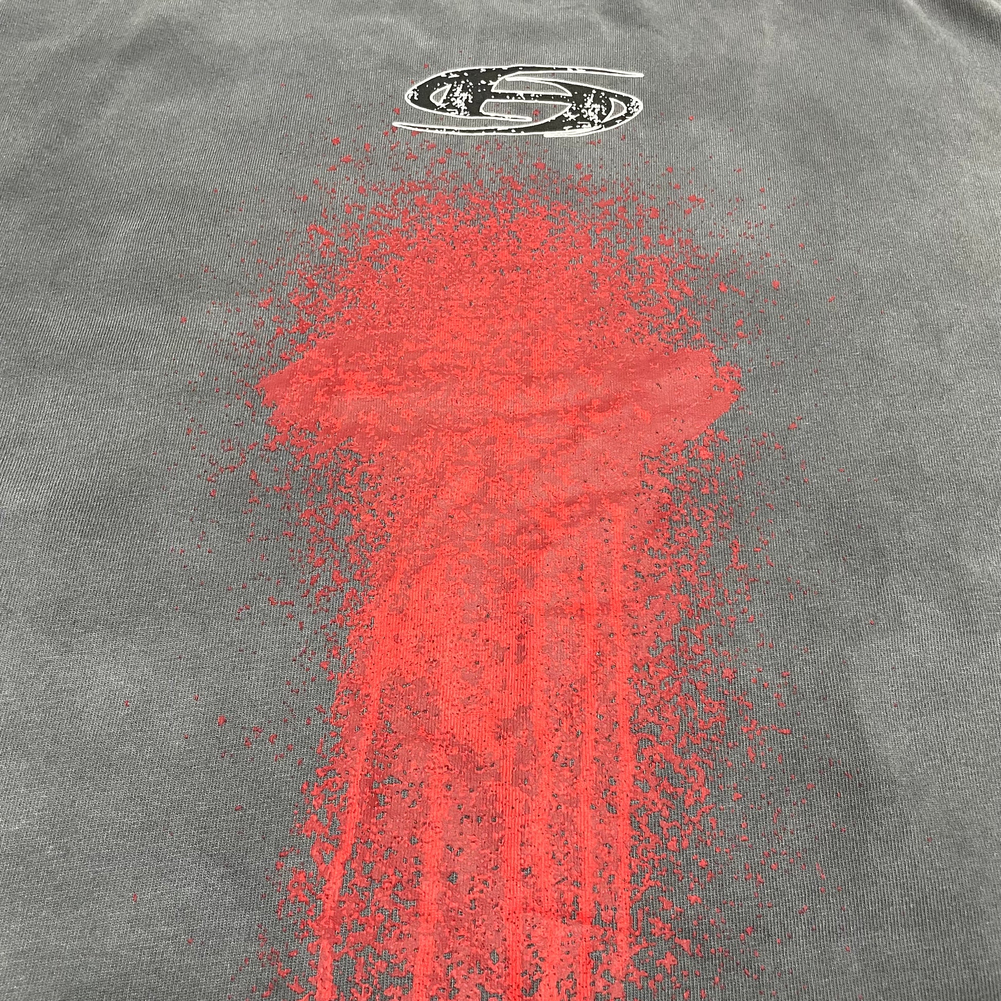Full back red spray-paint graphic on Hellstar washed grey T-shirt
Close-up of oversized red spray-paint graphic on the back of Hellstar T-shirt
Detailed view of red paint splatter and drip print on Hellstar washed grey T-shirt