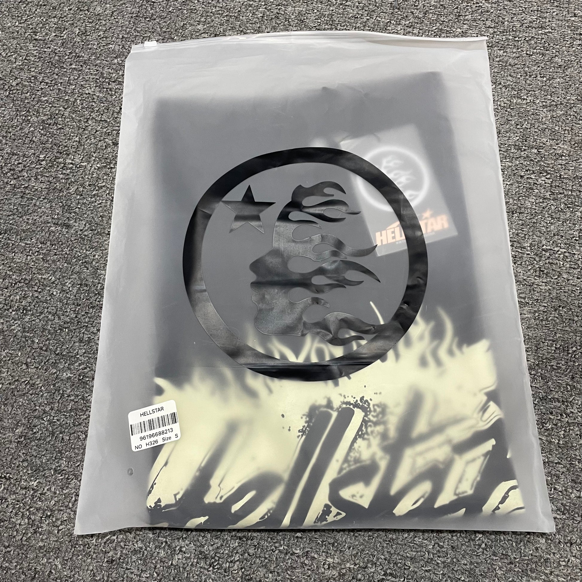 Hellstar Records washed black T-shirt inside branded zip packaging