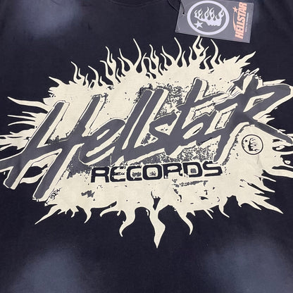 Oversized Hellstar Records flame logo graphic on washed black T-shirt
Hellstar Records distressed cream graphic with flame and splatter details on black T-shirt
Close-up of distressed Hellstar Records front logo on washed black T-shirt
