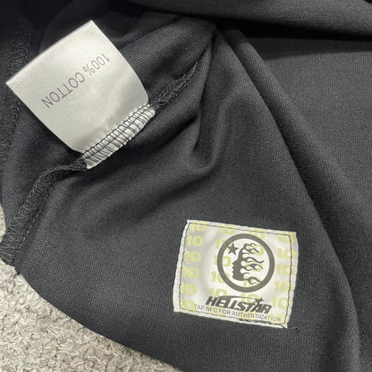 Close-up of double-stitched bottom hem on Hellstar Records T-shirt
Fabric composition and care label inside Hellstar Records T-shirt
NFC tag detail on Hellstar Records graphic T-shirt
