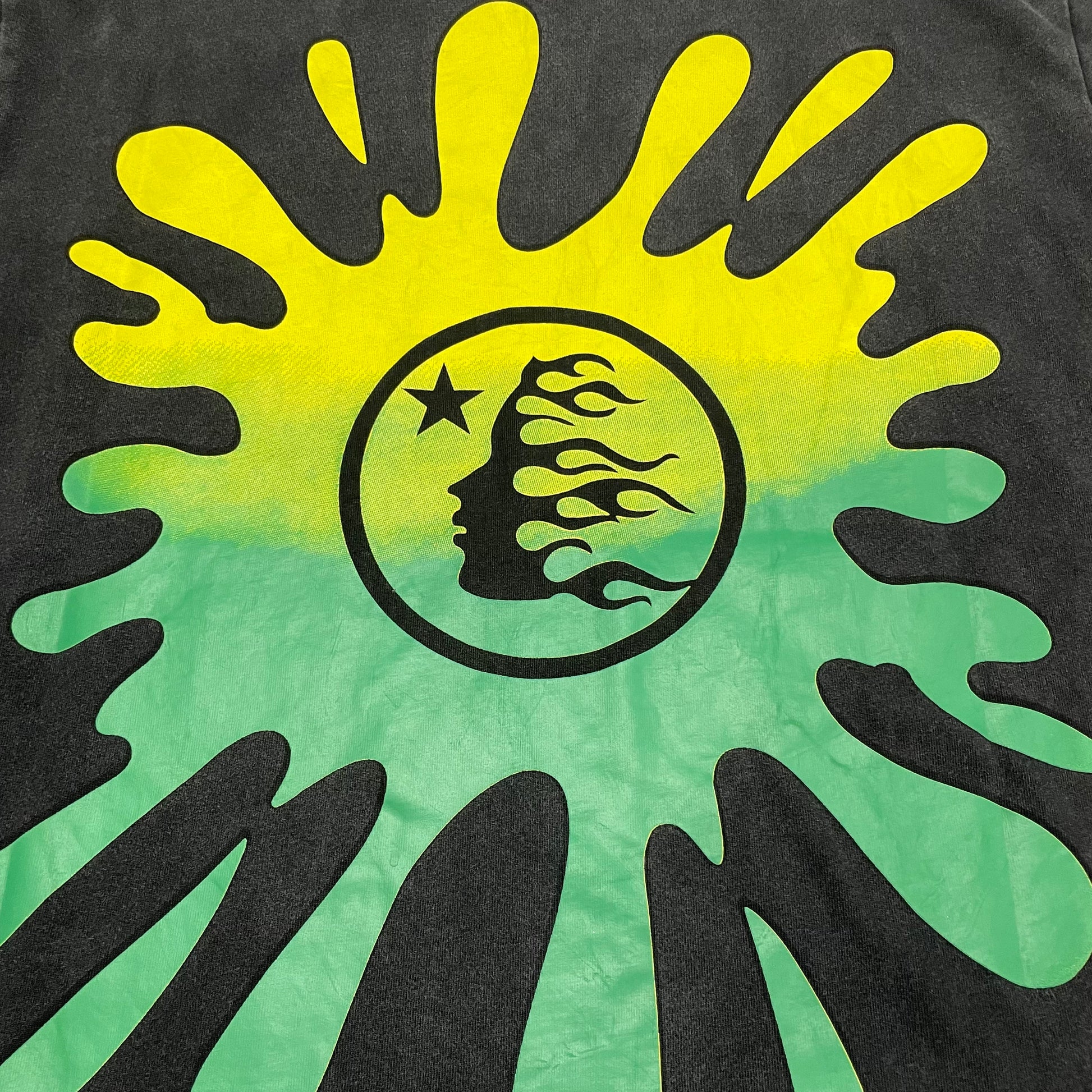Yellow starburst with Hellstar flame-face logo beside the Santa graphic
Detailed view of distressed print texture on Hellstar Santa Graphic T-shirt
Vintage washed black finish on Hellstar Santa Graphic T-shirt