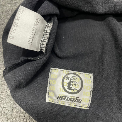 Close-up of bottom hem stitching on Hellstar Sports washed black T-shirt
Fabric composition and care label inside Hellstar Sports graphic T-shirt
NFC tag detail on Hellstar Sports mouth graphic T-shirt