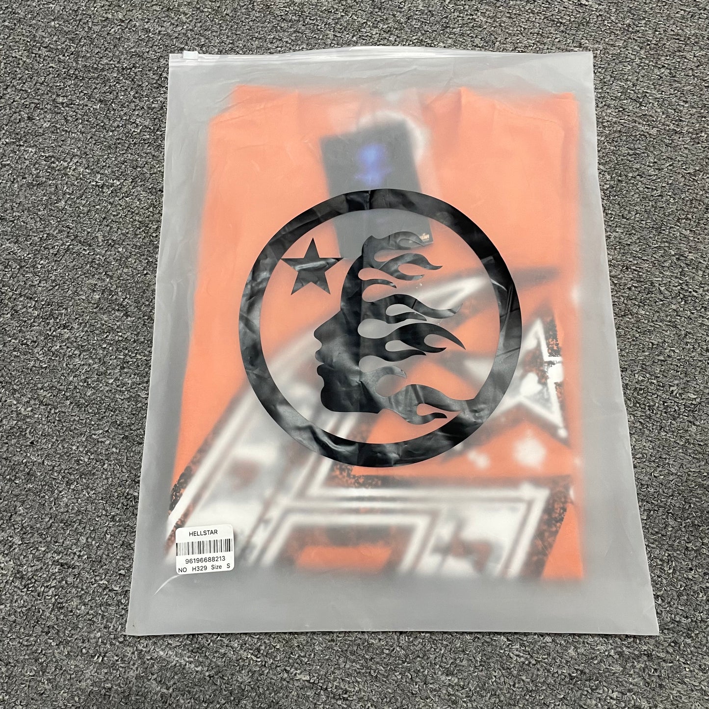 Hellstar H Sharp orange T-shirt inside branded zip packaging
Hellstar H Sharp orange graphic T-shirt product video preview