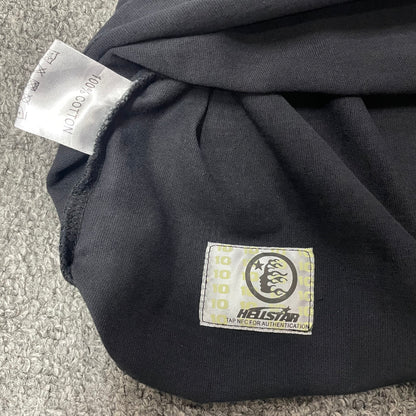 Close-up of bottom hem stitching on Hellstar Spiderweb T-shirt
Fabric composition and care label inside Hellstar Spiderweb Sport Logo T-shirt
NFC tag detail on Hellstar Spiderweb Sport Logo black T-shirt