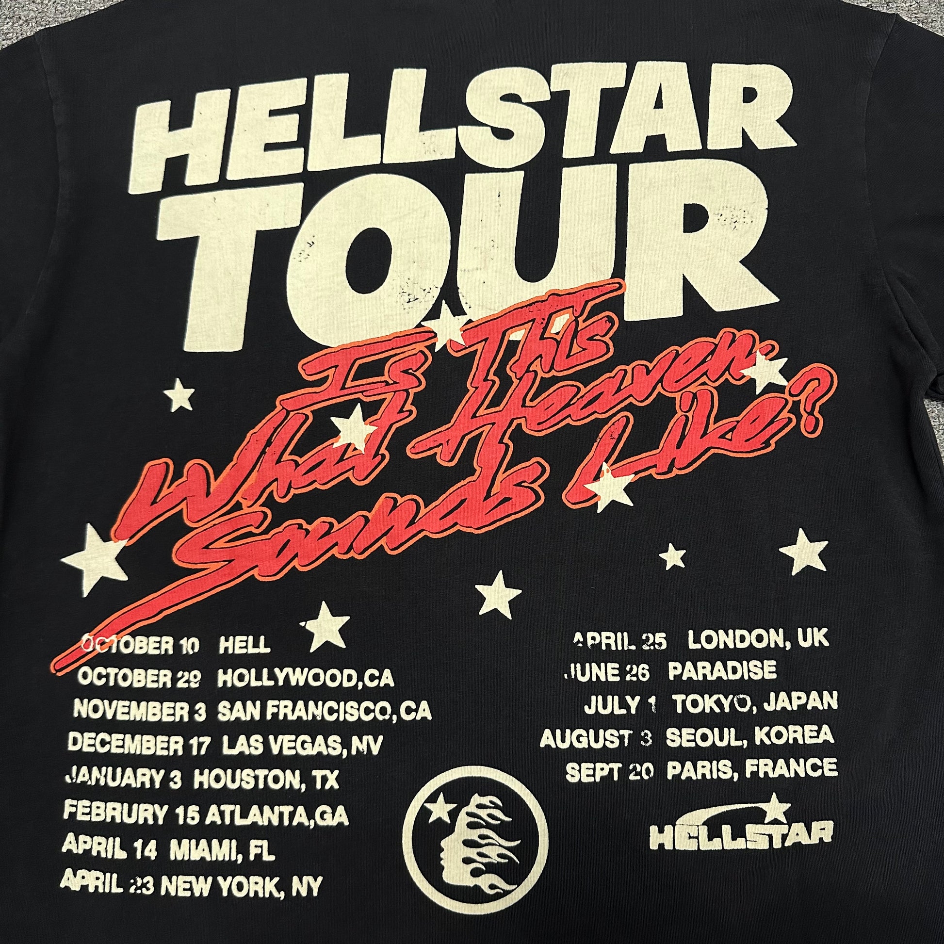 Detailed view of distressed and cracked print texture on Hellstar T-shirt
Vintage washed black and faded charcoal finish on Hellstar T-shirt
Close-up of fabric texture on Hellstar Path To Paradise graphic T-shirt