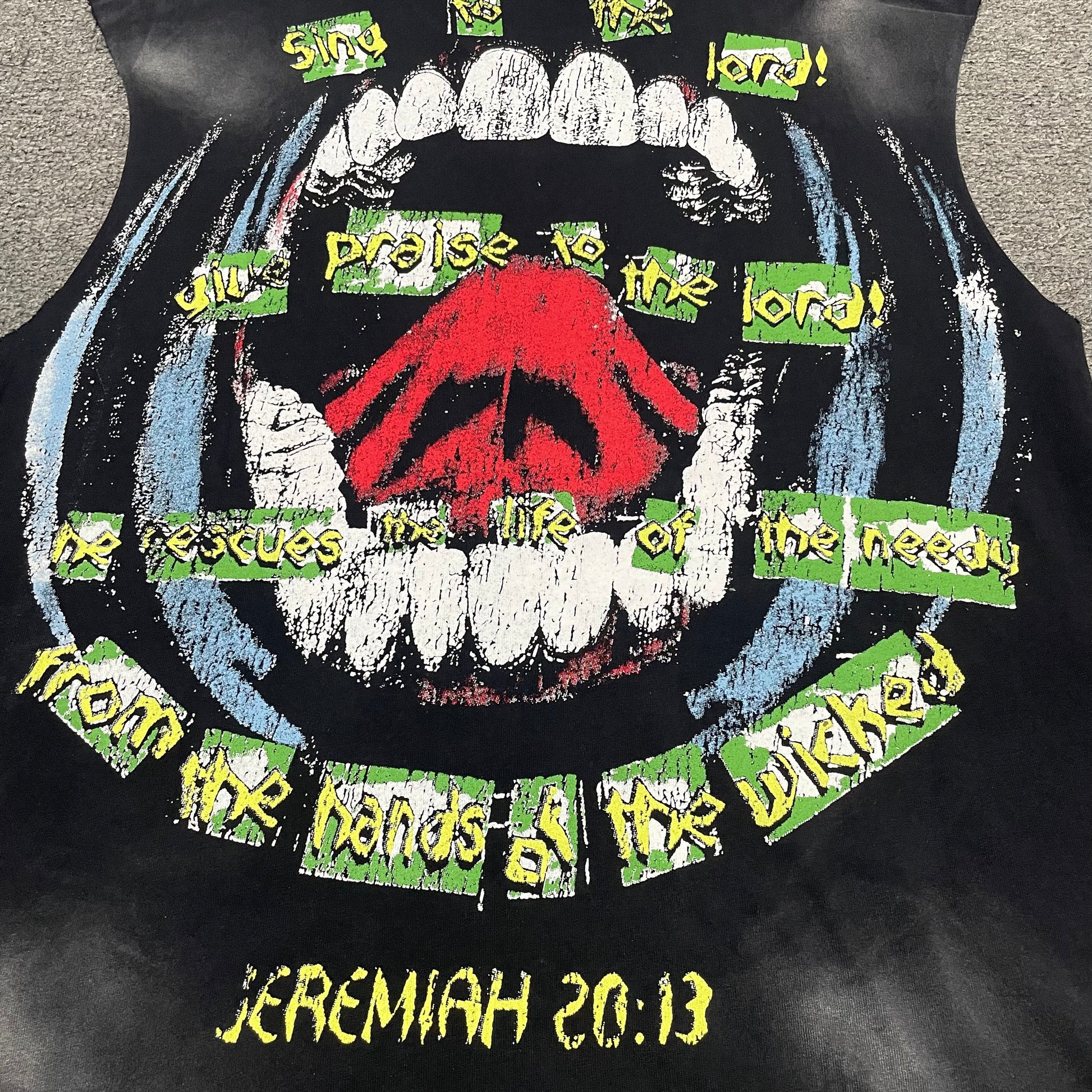 Full back slogan graphic on Hellstar Worship Hands sleeveless T-shirt
Close-up of worship slogan lettering on the back of Hellstar sleeveless T-shirt
Vintage washed black finish and faded areas on Hellstar sleeveless T-shirt