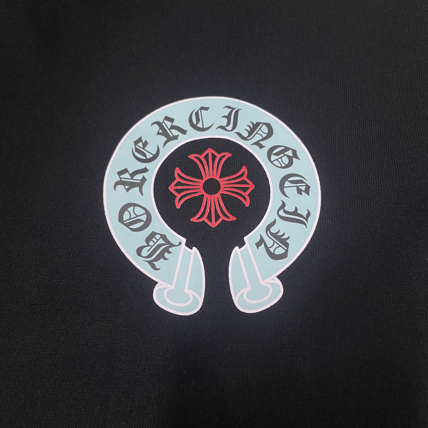 Chrome Hearts horseshoe cross chest logo print close up detail