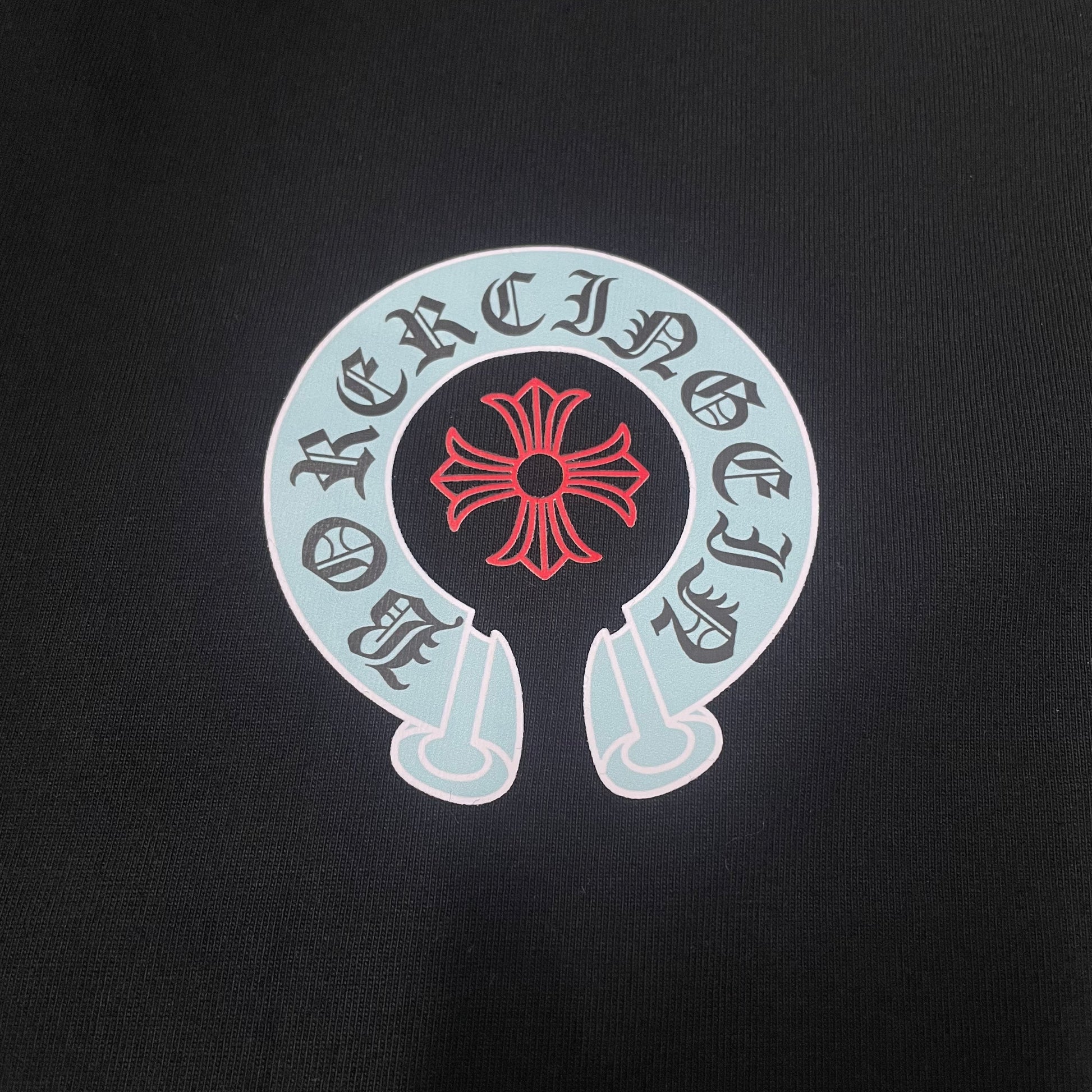 Chrome Hearts horseshoe cross chest logo print close up detail