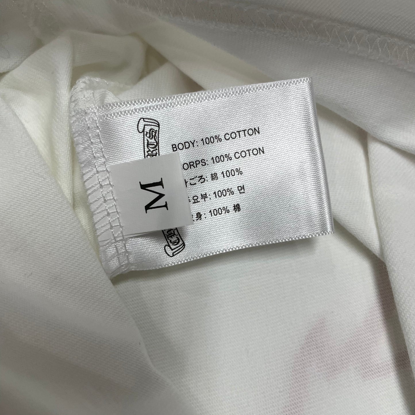 Chrome Hearts style t-shirt size label wash label and hem stitching detail