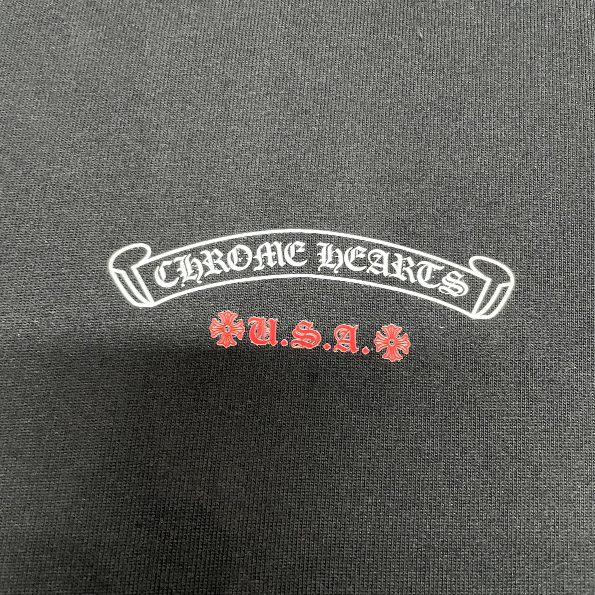 Small Chrome Hearts USA chest logo print detail on black American Flag T-shirt