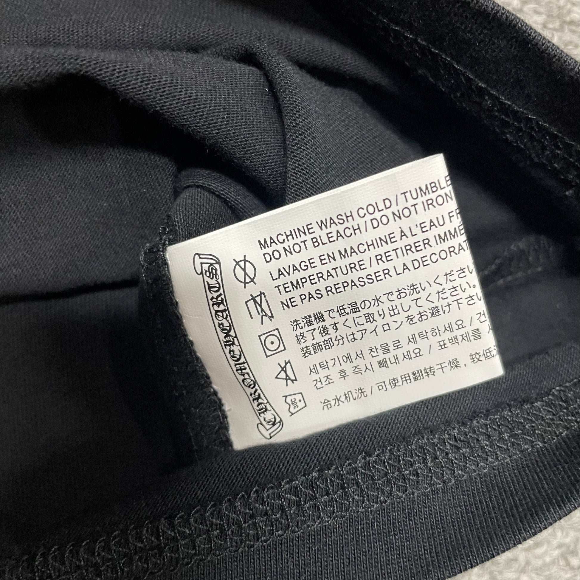 Chrome Hearts American Flag T-shirt size label wash label and double stitched hem detail
