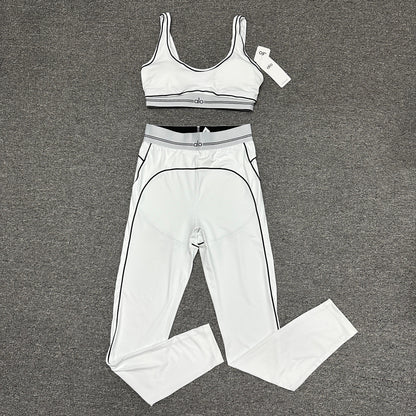 ALO Heart Throb Bra and High-Waist Legging Set in White Black front view