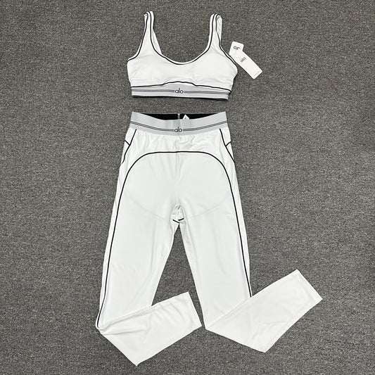 ALO Heart Throb Bra and High-Waist Legging Set in White Black front view