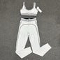 ALO Heart Throb Bra and High-Waist Legging Set in White Black front view
