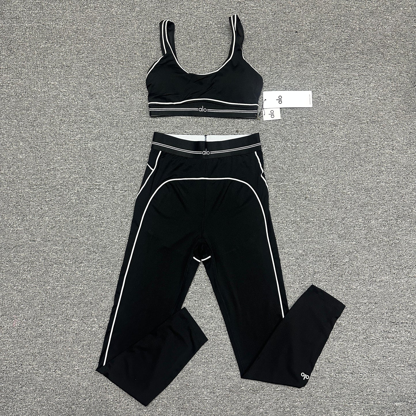 ALO Heart Throb Bra and High-Waist Legging Set in Black White front view