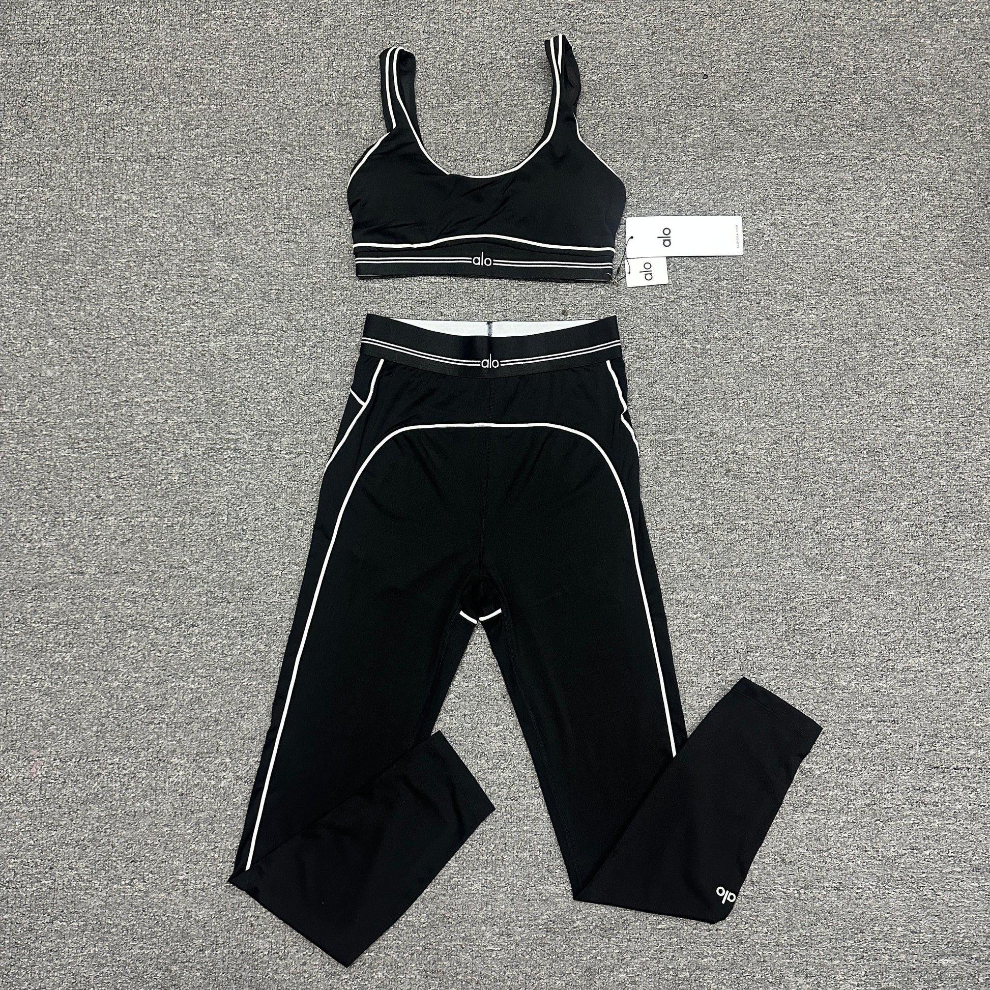 ALO Heart Throb Bra and High-Waist Legging Set in Black White front view