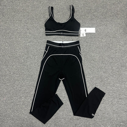 ALO Heart Throb Bra and High-Waist Legging Set in Black White front view