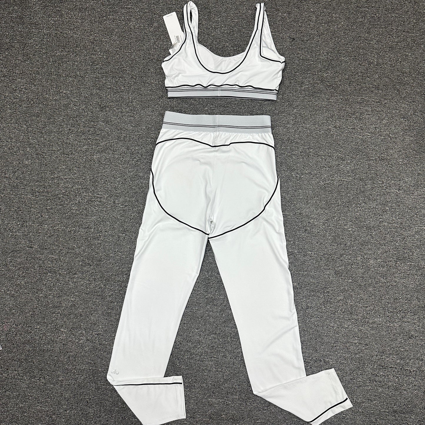 ALO Heart Throb White Black bra and high-waist legging set back view