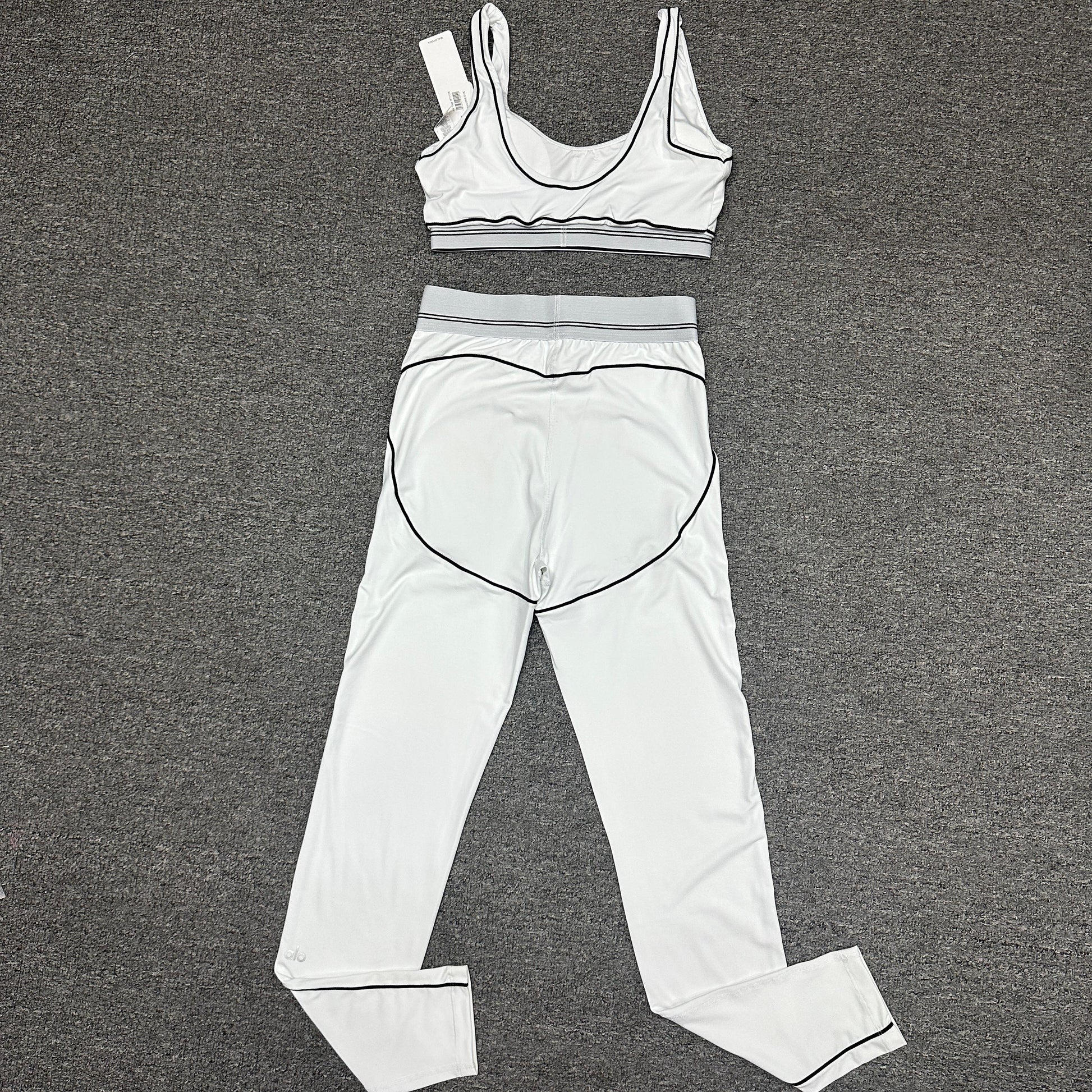 ALO Heart Throb White Black bra and high-waist legging set back view