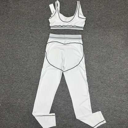 ALO Heart Throb White Black bra and high-waist legging set back view
